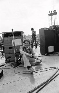 Photographer Baron Wolman is photographed by Bill Graham during the Woodstock Festival, Bethel, NY, August 1969.