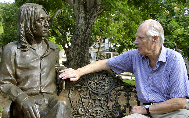 MARTIN...Beatles producer George Martin touches a statue of John Lennon in a park in the Vedado neighborhood of Havana, during his visit to Cuba, Wednesday, Oct. 30, 2002. During his trip to Cuba, which began Tuesday night, Martin will give a talk about the Beatles and will direct a local orchestra. (AP Photo/Cristobal Herrera)