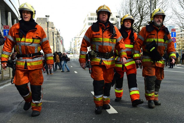 Firefighters arrive at a security perimeter set near Maalbeek metro station,  on March 22, 2016  in Brussels, after a blast at this station near the EU institutions caused deaths and injuries.  AFP PHOTO / EMMANUEL DUNAND / AFP / EMMANUEL DUNAND        (Photo credit should read EMMANUEL DUNAND/AFP/Getty Images)