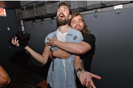 Bastille band members Kyle Simmons and Chris Wood hugged it out at the NYLON Nights x Stillhouse whiskey event.
